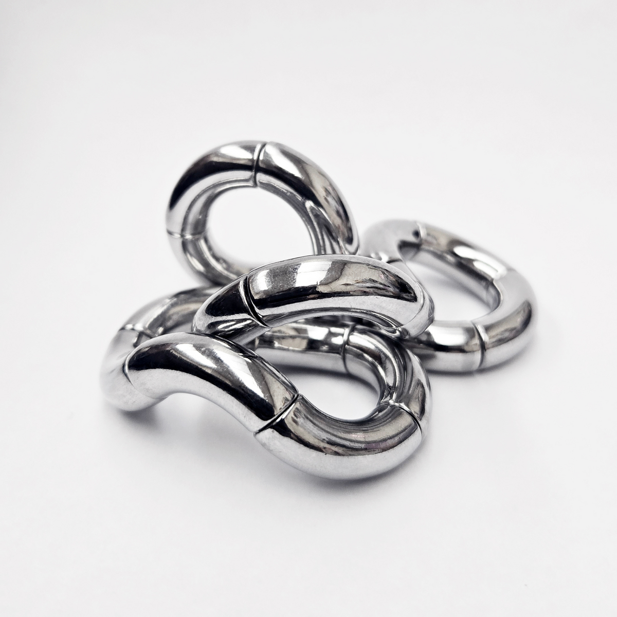Tangle Jr. Metal – tung fidgetskulptur i metall